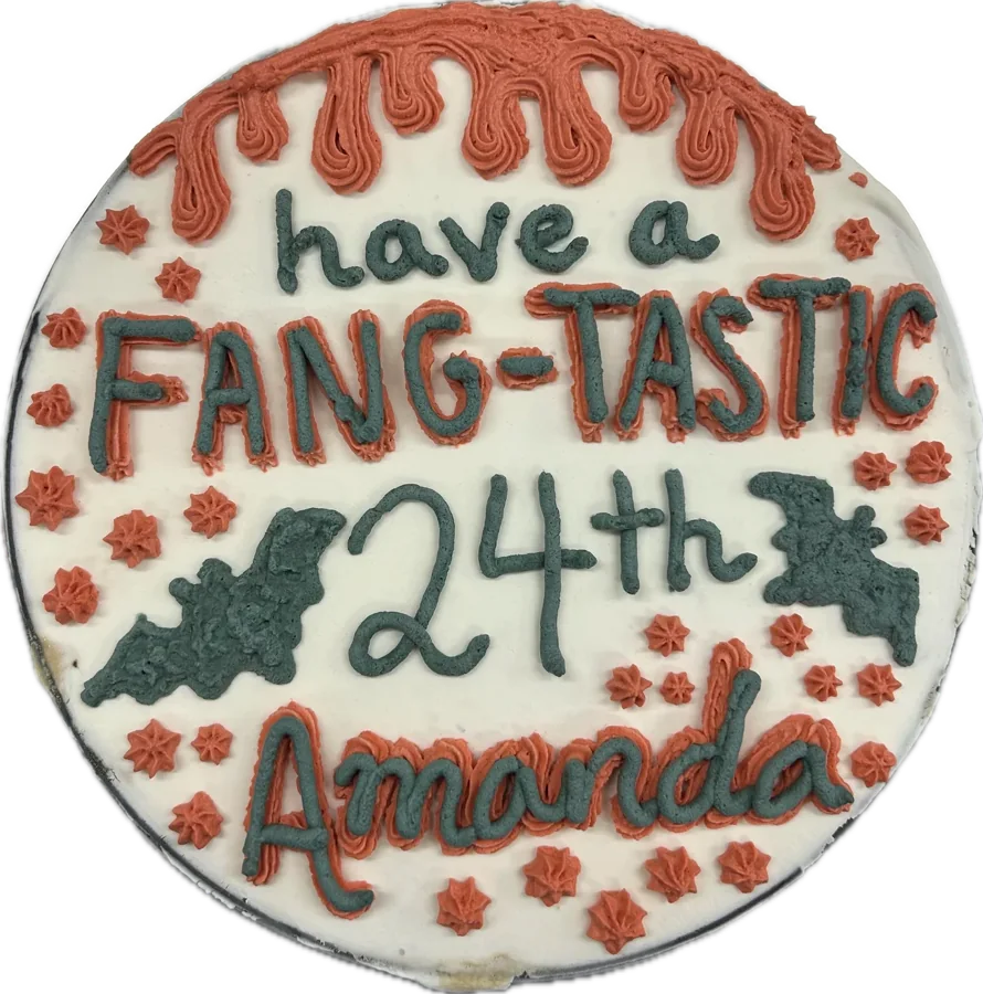 Halloween ice cream cake piped with “Have a Fang-tastic 24th Amanda” and bats