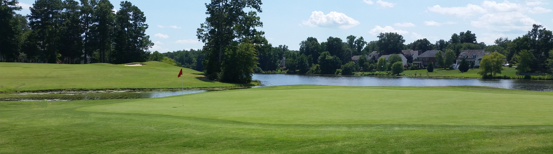 Birkdale Golf Club’s lakeside green and tree-lined fairways