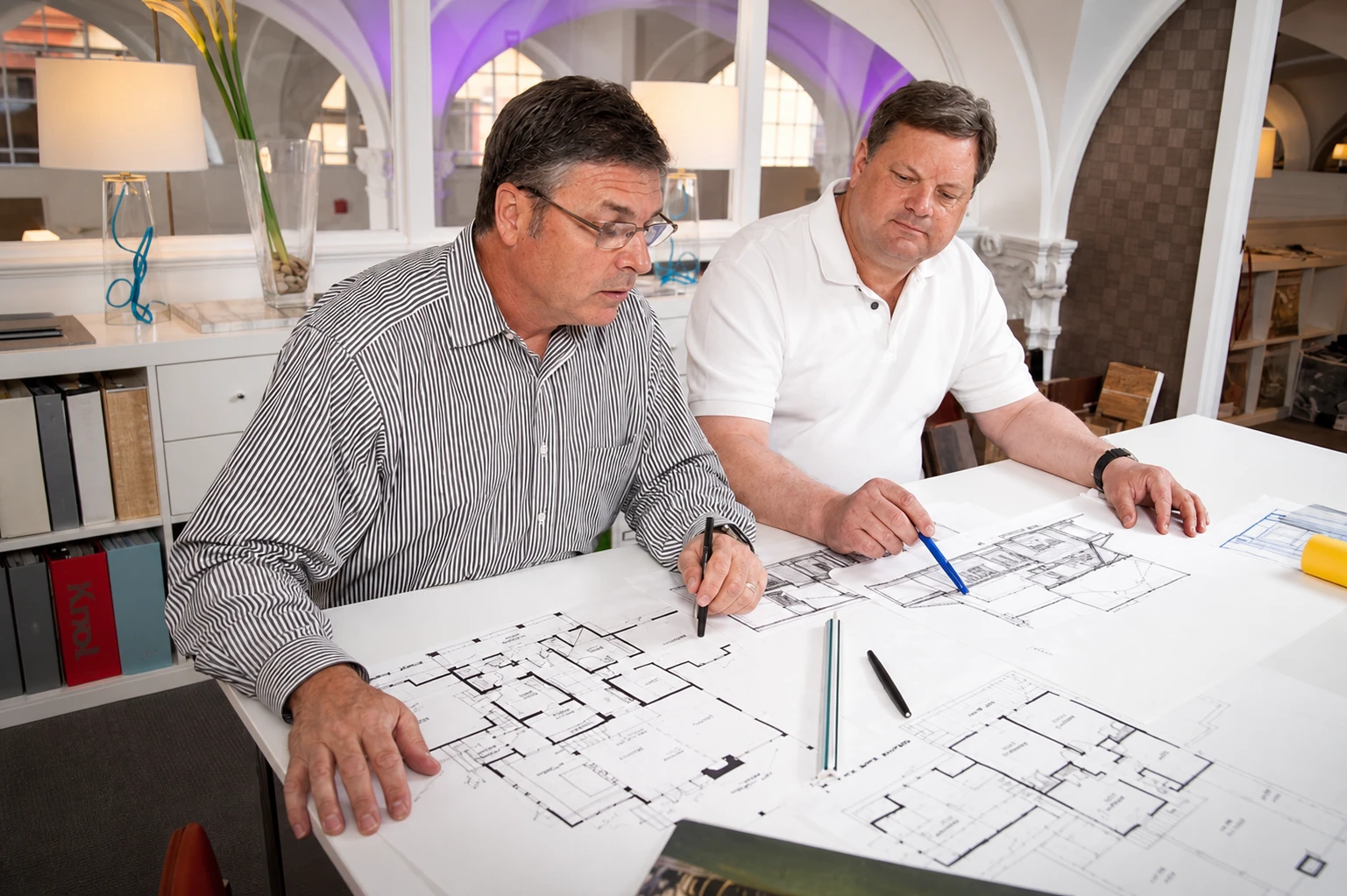 The R.E. Collier team reviewing architectural plans